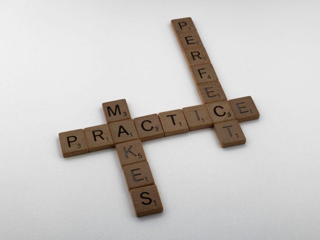 brown wooden cross on white surface